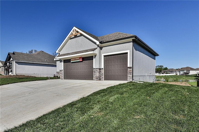 view of side of home featuring a lawn and a garage