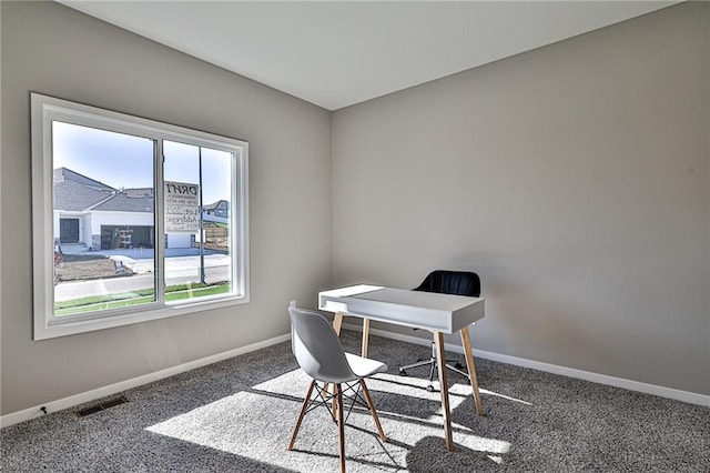 home office with baseboards, carpet floors, and visible vents