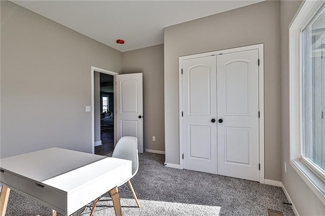 office space featuring baseboards and carpet floors