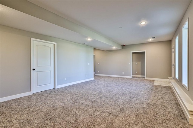 spare room with light carpet, baseboards, and recessed lighting