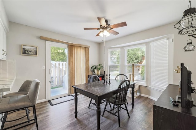 dining space with dark wood-type flooring, plenty of natural light, and ceiling fan