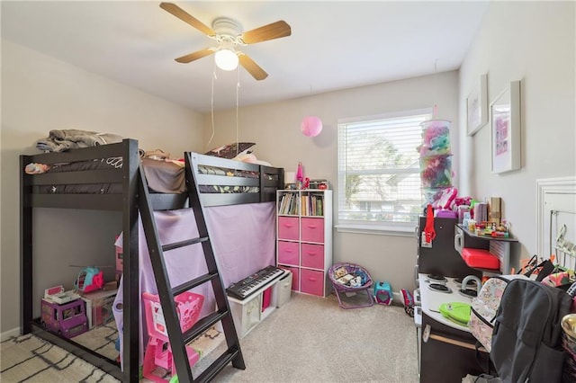 bedroom with ceiling fan and light colored carpet