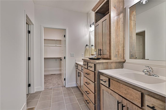 bathroom featuring tile patterned flooring and vanity