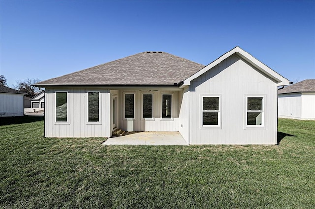 back of house featuring a patio and a yard