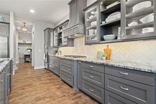 2804 NW Nutall Ct, Lees Summit, MO 64081 - kitchen featuring open shelves, custom range hood, gray cabinets, light stone countertops, and recessed lighting