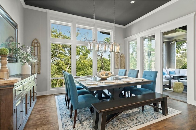 2804 NW Nutall Ct, Lees Summit, MO 64081 - dining area featuring ornamental molding, a chandelier, and dark wood-style floors