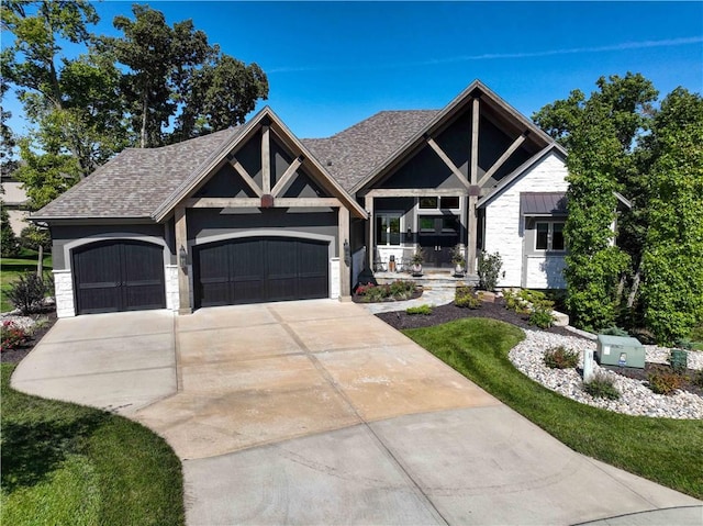 view of front facade with a front yard and a garage