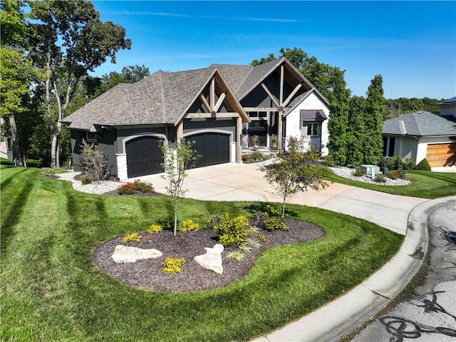 view of front facade featuring a front lawn and a garage