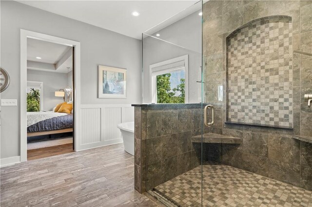 2804 NW Nutall Ct, Lees Summit, MO 64081 - full bath featuring wood finished floors, a shower stall, ensuite bathroom, a soaking tub, and a wainscoted wall