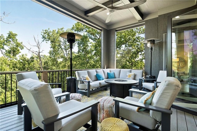 wooden terrace featuring an outdoor living space with a fire pit and ceiling fan