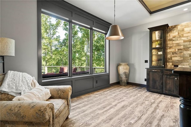 sitting room featuring light hardwood / wood-style floors and plenty of natural light