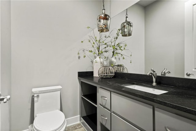 bathroom with toilet and vanity