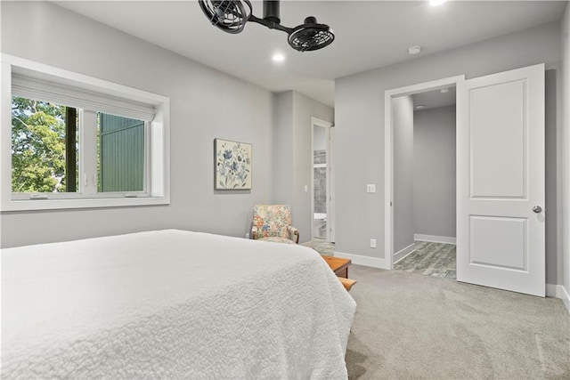 carpeted bedroom with ensuite bath