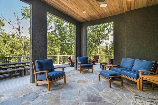 sunroom featuring wooden ceiling