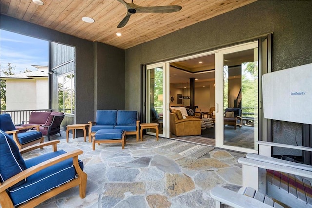 view of patio featuring an outdoor living space and ceiling fan