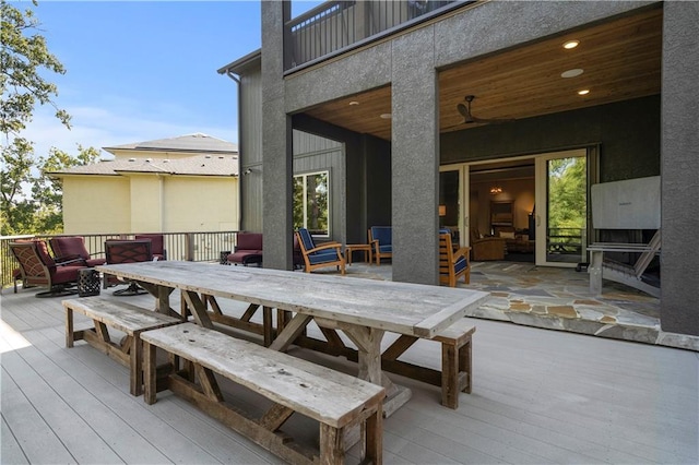 wooden terrace featuring an outdoor hangout area