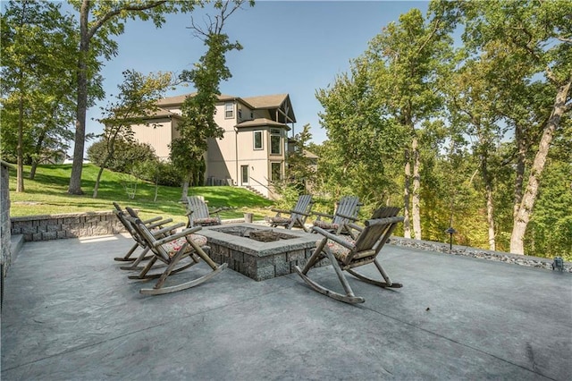 view of patio with an outdoor fire pit