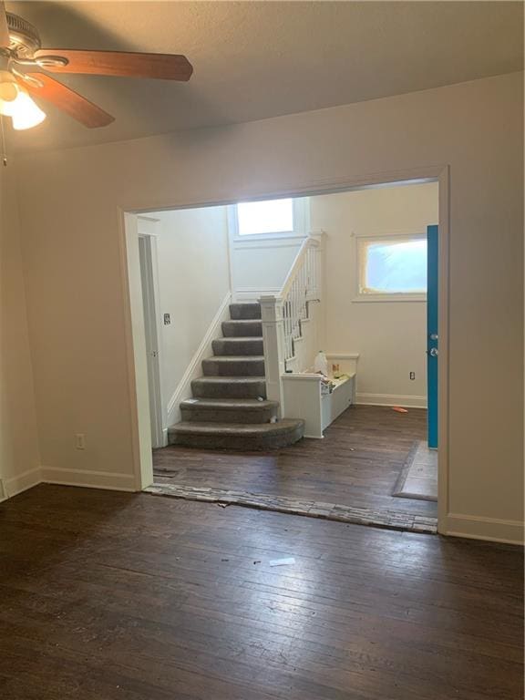 interior space featuring dark hardwood / wood-style flooring and ceiling fan