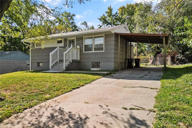 view of front of property with a carport and a front yard