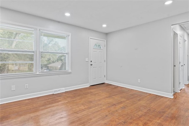 foyer entrance with light hardwood / wood-style flooring