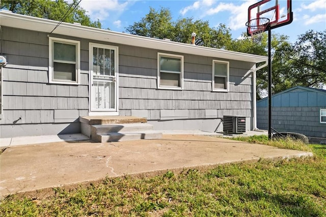 doorway to property featuring central air condition unit