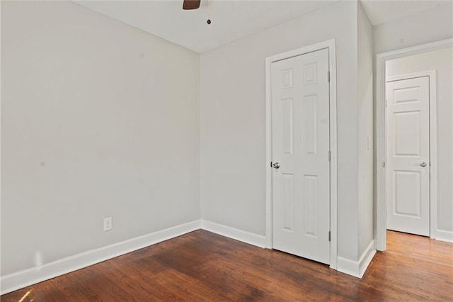 unfurnished bedroom featuring ceiling fan and hardwood / wood-style flooring