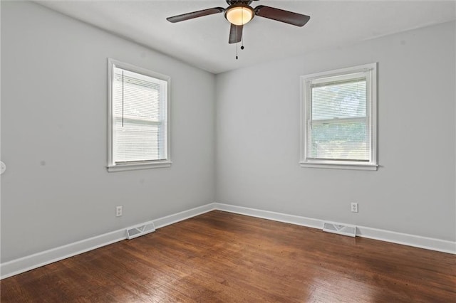 spare room featuring hardwood / wood-style flooring and ceiling fan