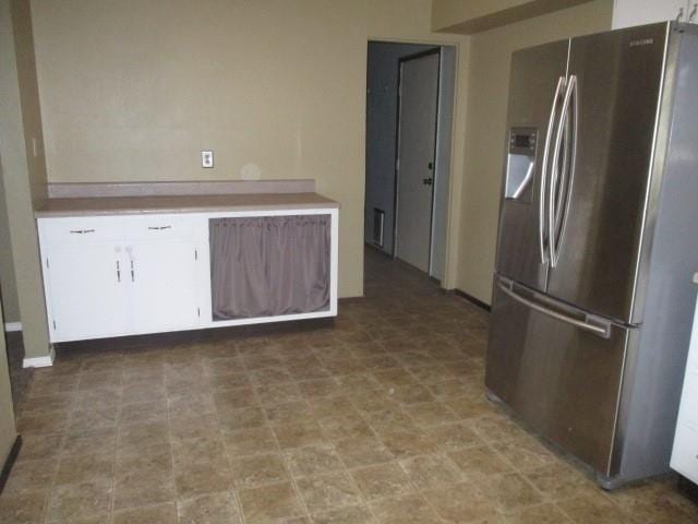 kitchen with stainless steel refrigerator with ice dispenser