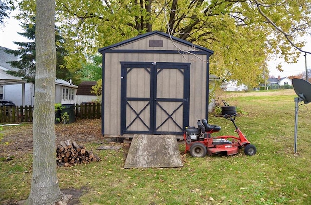 view of outdoor structure featuring a lawn