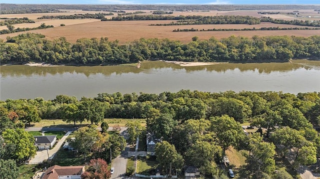 birds eye view of property featuring a water view and a rural view