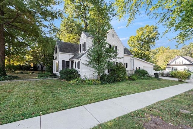 view of property exterior featuring a lawn