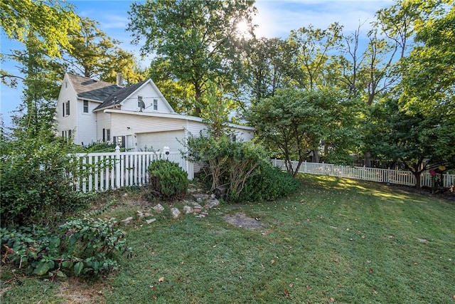 view of yard featuring a garage