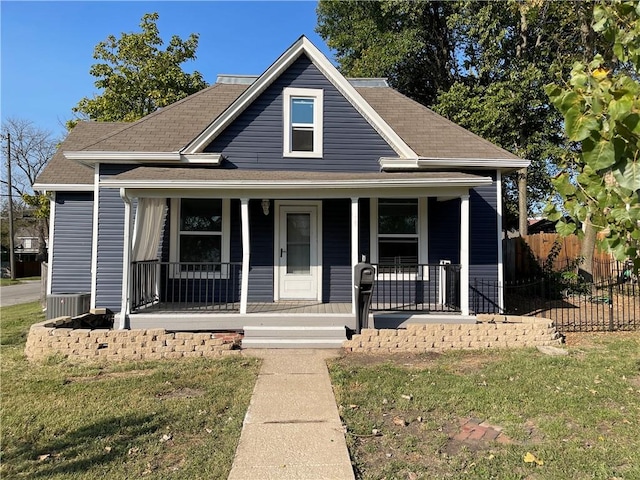 view of front of property with a front lawn and covered porch