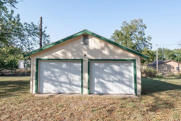 garage with a lawn