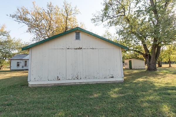 view of property exterior with a lawn