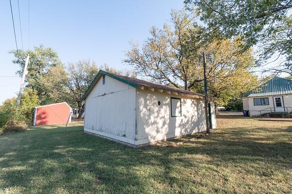 view of outdoor structure featuring a yard