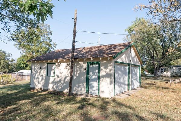 view of outbuilding featuring a yard