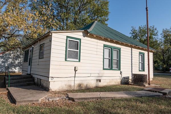 view of side of home with central AC unit