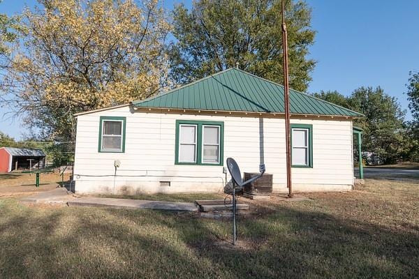 rear view of house with a yard