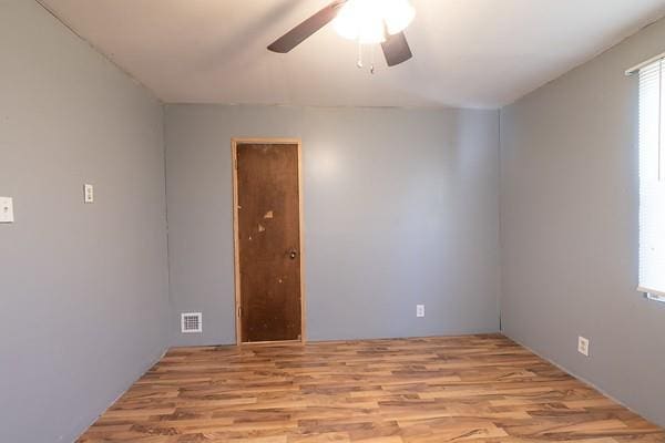 unfurnished room with ceiling fan and light hardwood / wood-style flooring