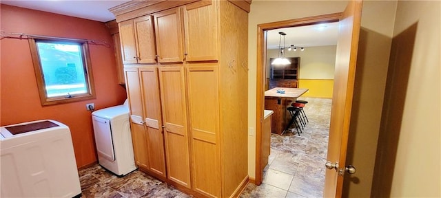 1516 E Lincoln St, Iola, KS 66749 - laundry area featuring washer and dryer and cabinet space