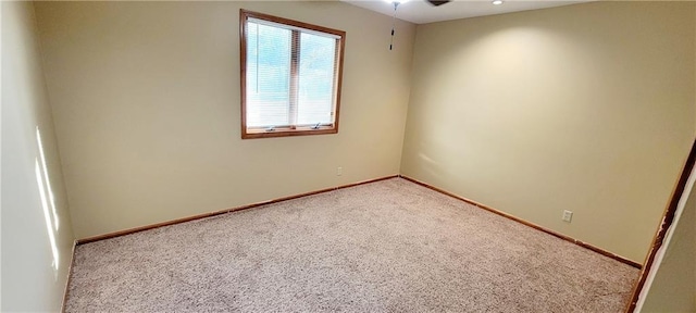 1516 E Lincoln St, Iola, KS 66749 - unfurnished room featuring carpet flooring, baseboards, and a ceiling fan