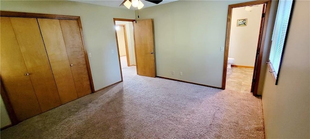 1516 E Lincoln St, Iola, KS 66749 - unfurnished bedroom featuring carpet floors, a closet, a ceiling fan, and baseboards