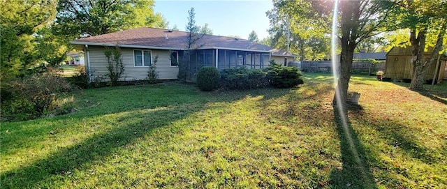 1516 E Lincoln St, Iola, KS 66749 - back of property featuring a sunroom