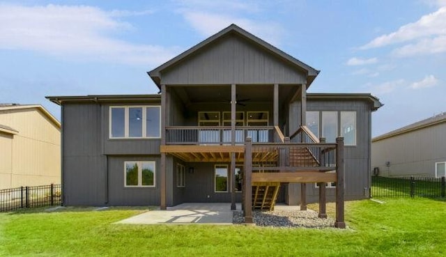 back of house with a yard, a patio, ceiling fan, and a deck