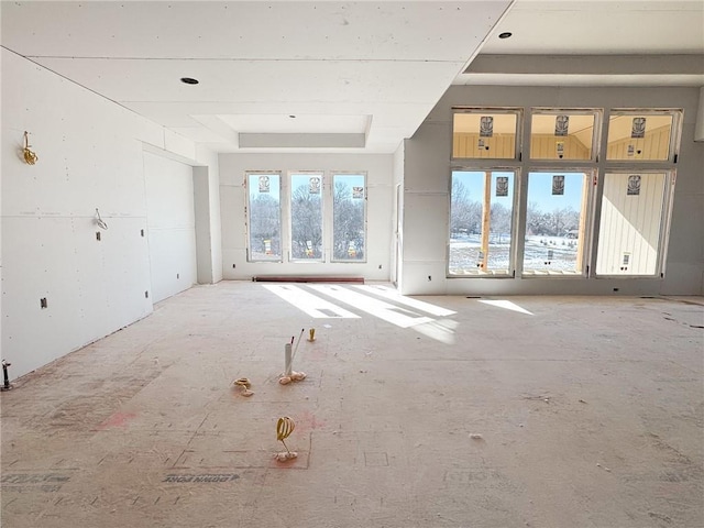 spare room with a tray ceiling