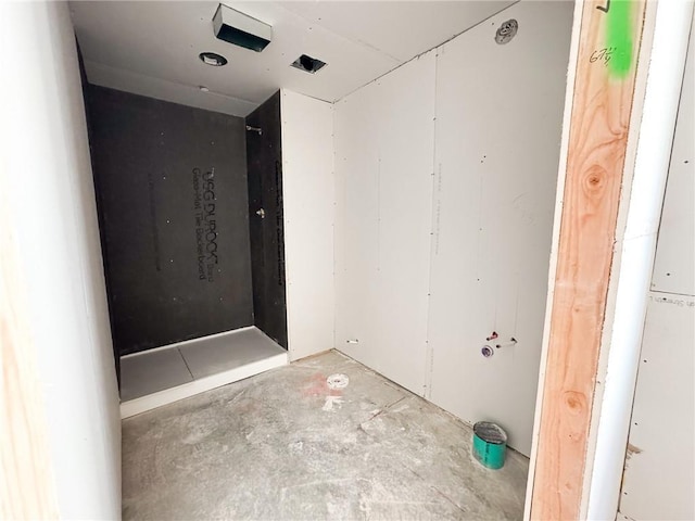 bathroom with concrete flooring