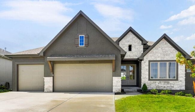 view of front of home featuring a garage, concrete driveway, french doors, and stucco siding