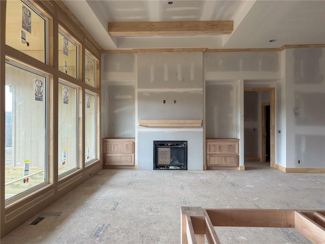 unfurnished living room with beam ceiling, visible vents, and a fireplace