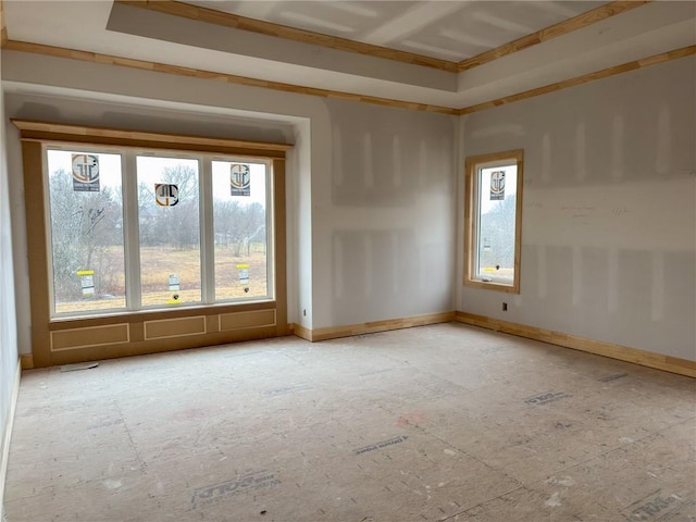 unfurnished room featuring baseboards